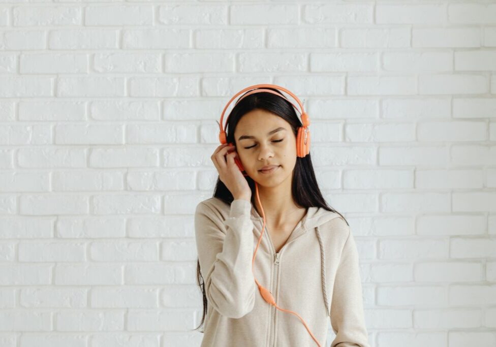 Young girl listening to headphones | SSP Therapy